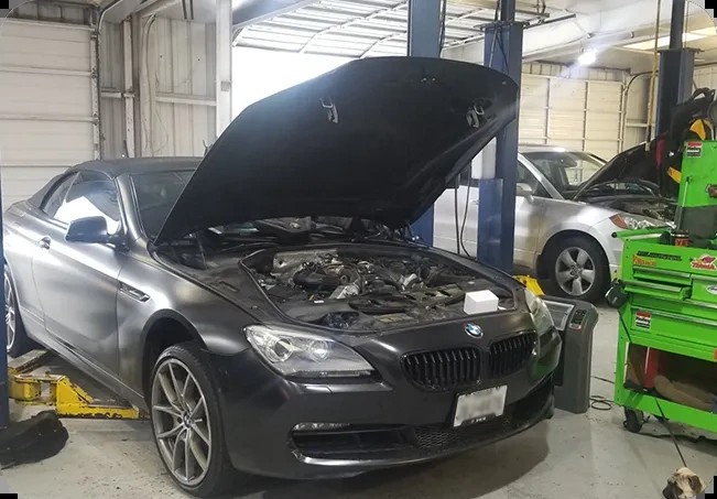 A BMW 6-Series on the lift at Dearing Automotive